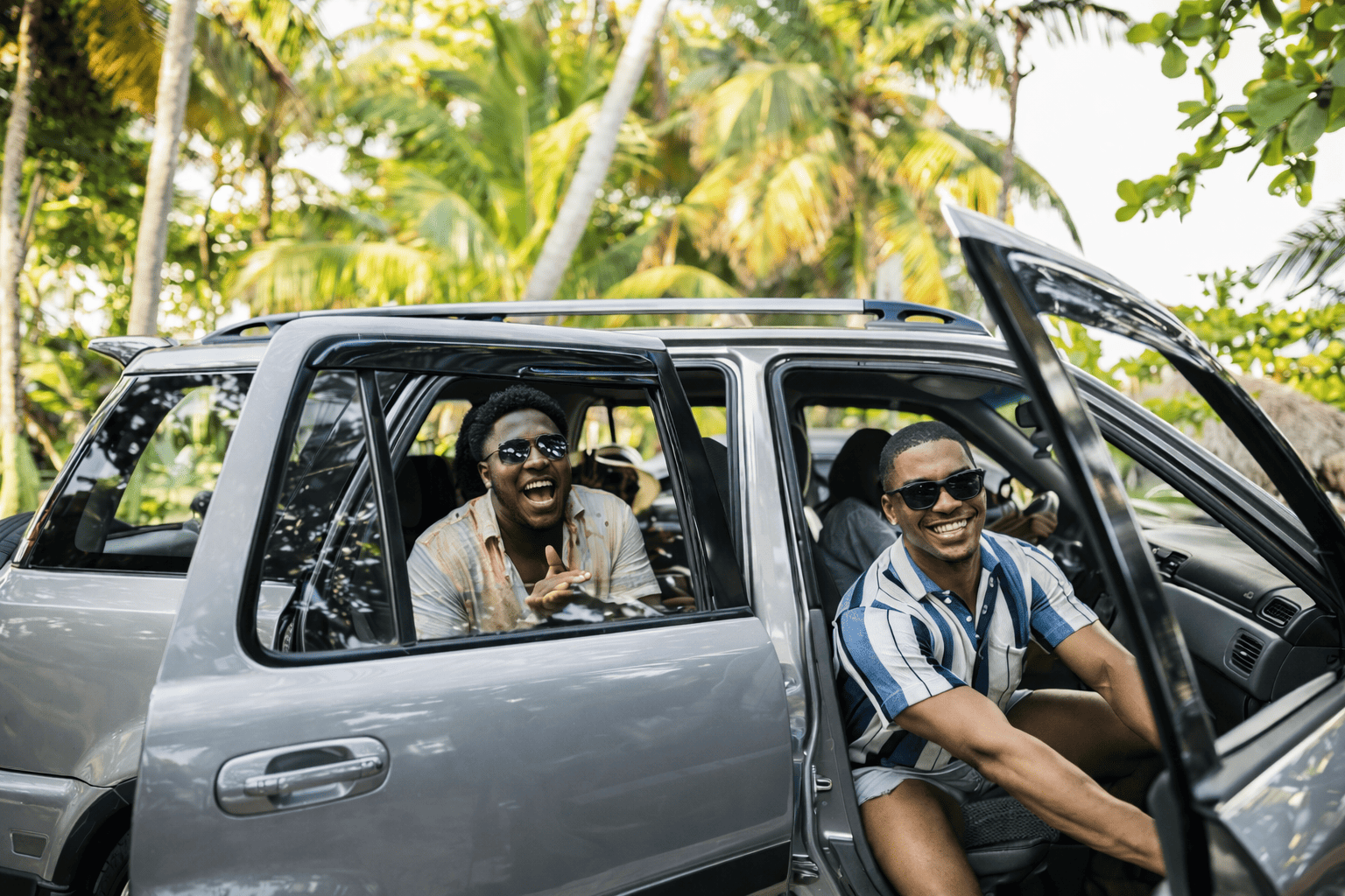 Two men in a car with open doors